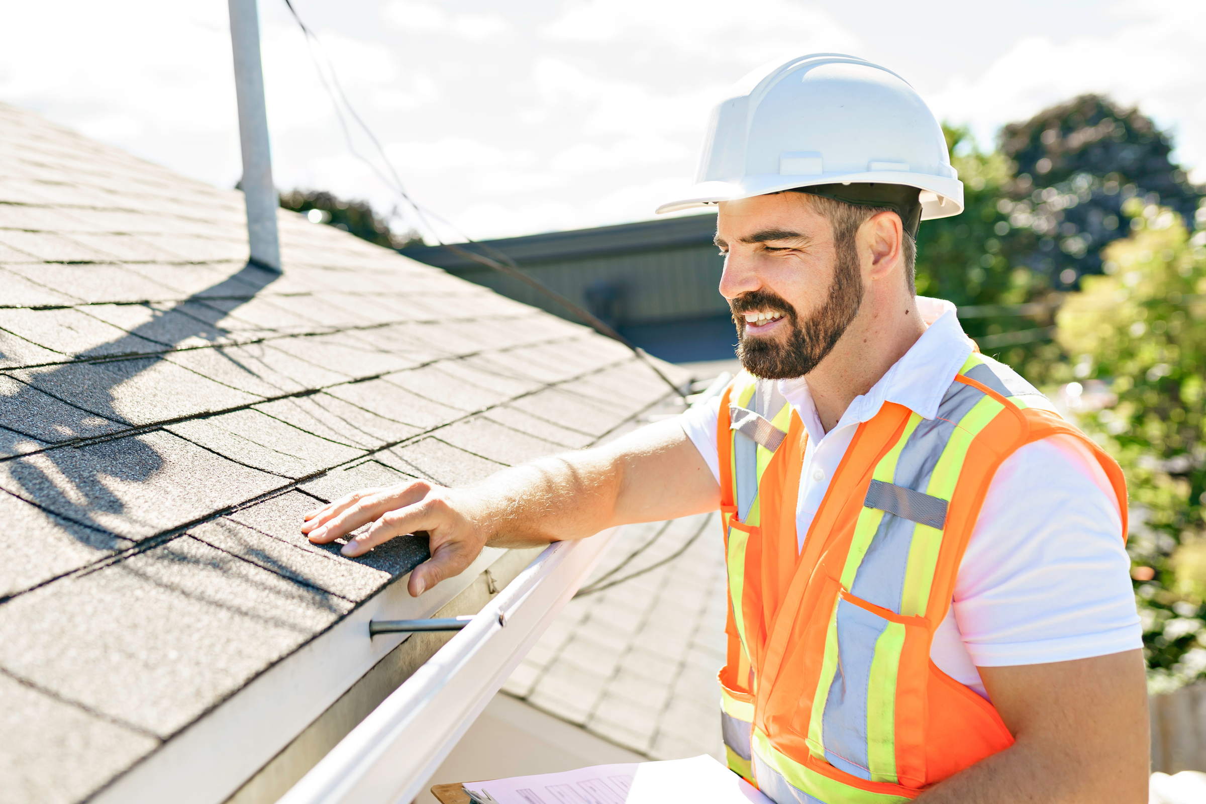 Inspector checking electrical exterior unit on residential home